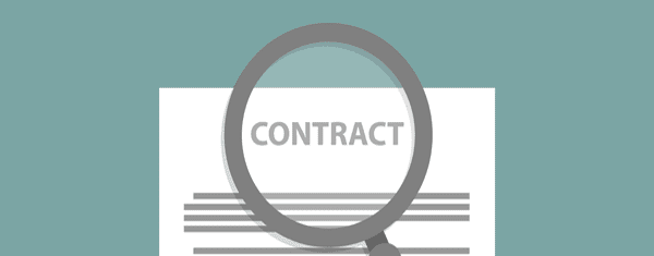 Contract viewed through magnifying glass