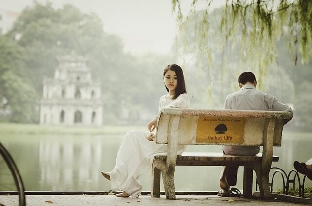 Sad couple on bench