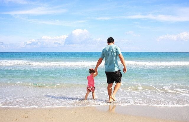 Father and child at beach