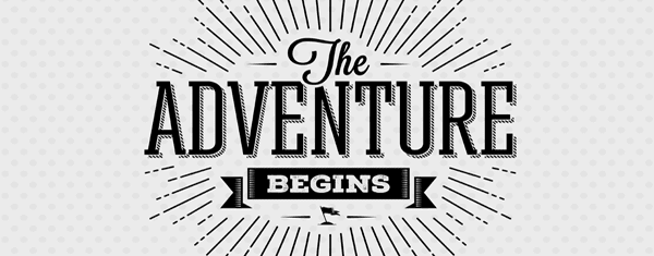 A sign that says "The adventure begins".