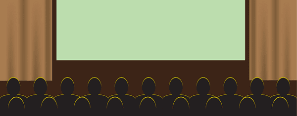 An audience watching a screen.