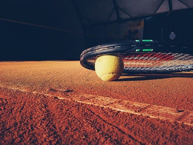 Tennis racquet and ball