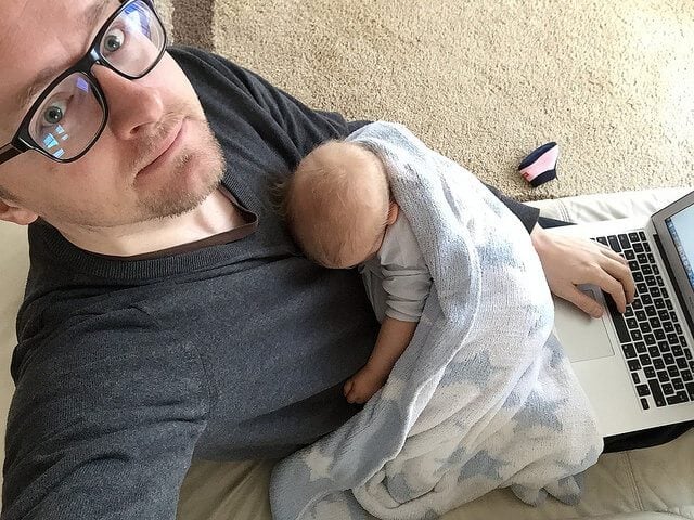 Man working with baby