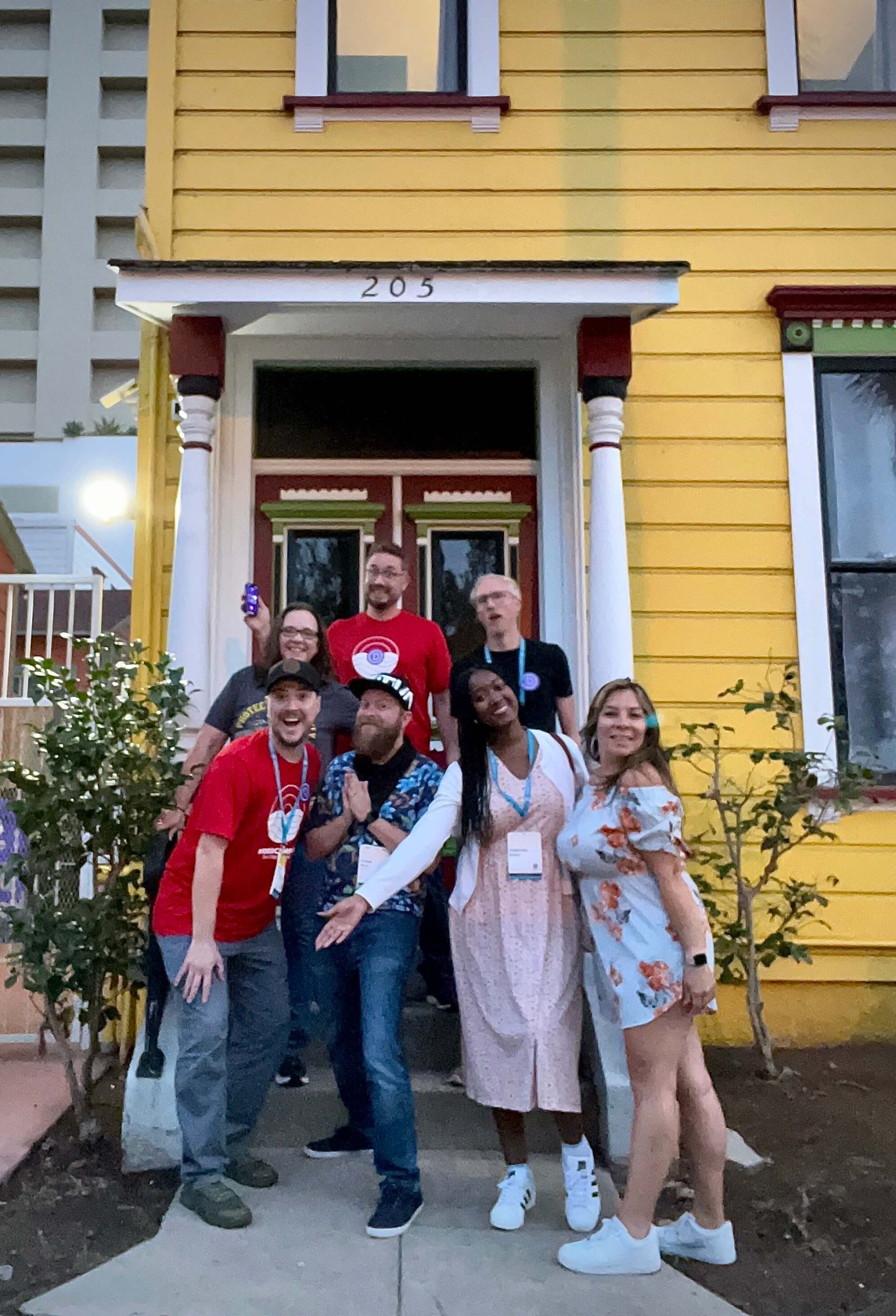 Elegant Themes WCUS Content Team standing on steps in front of their airbnb