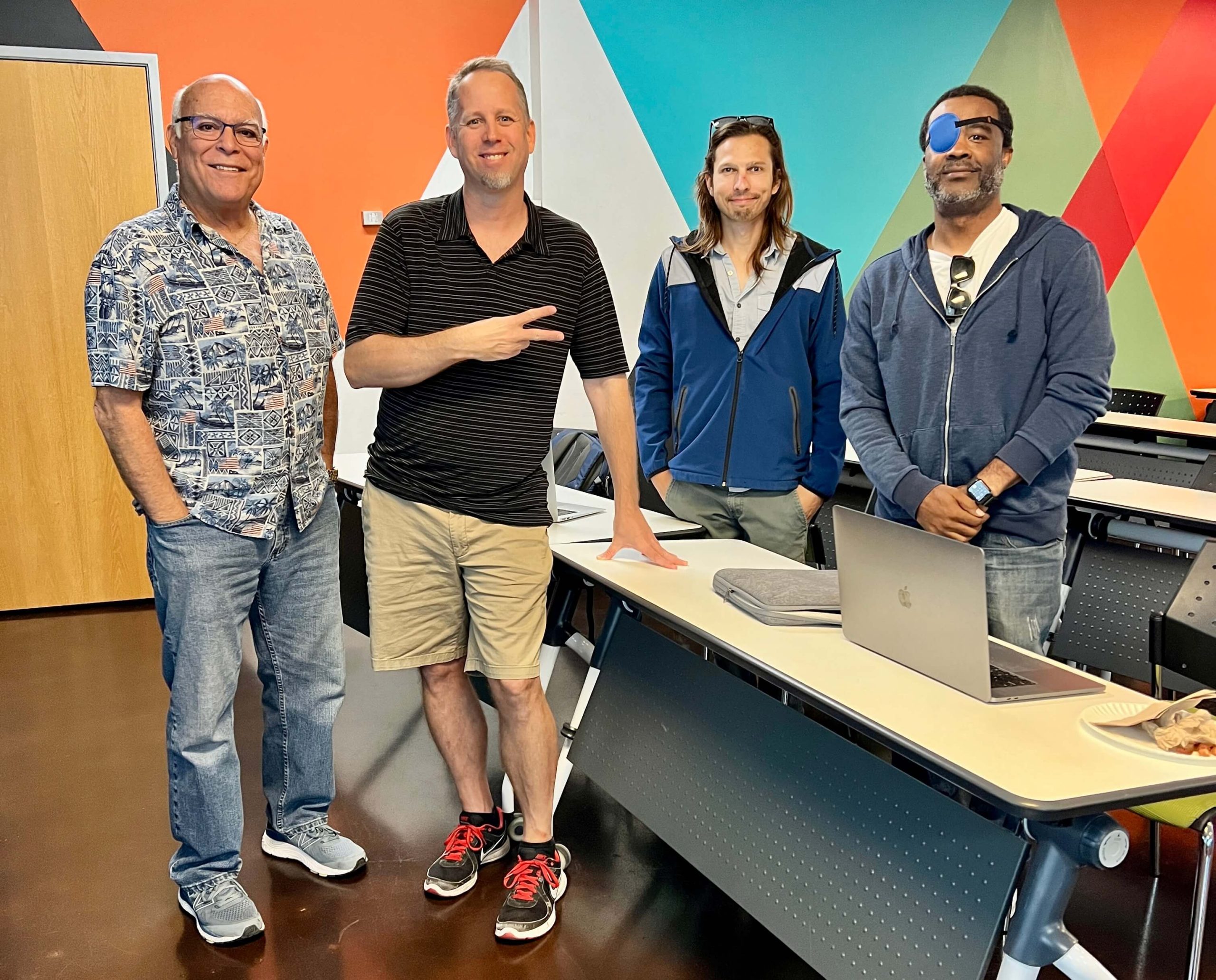 group of four men standing at the Divi Phoenix meetup