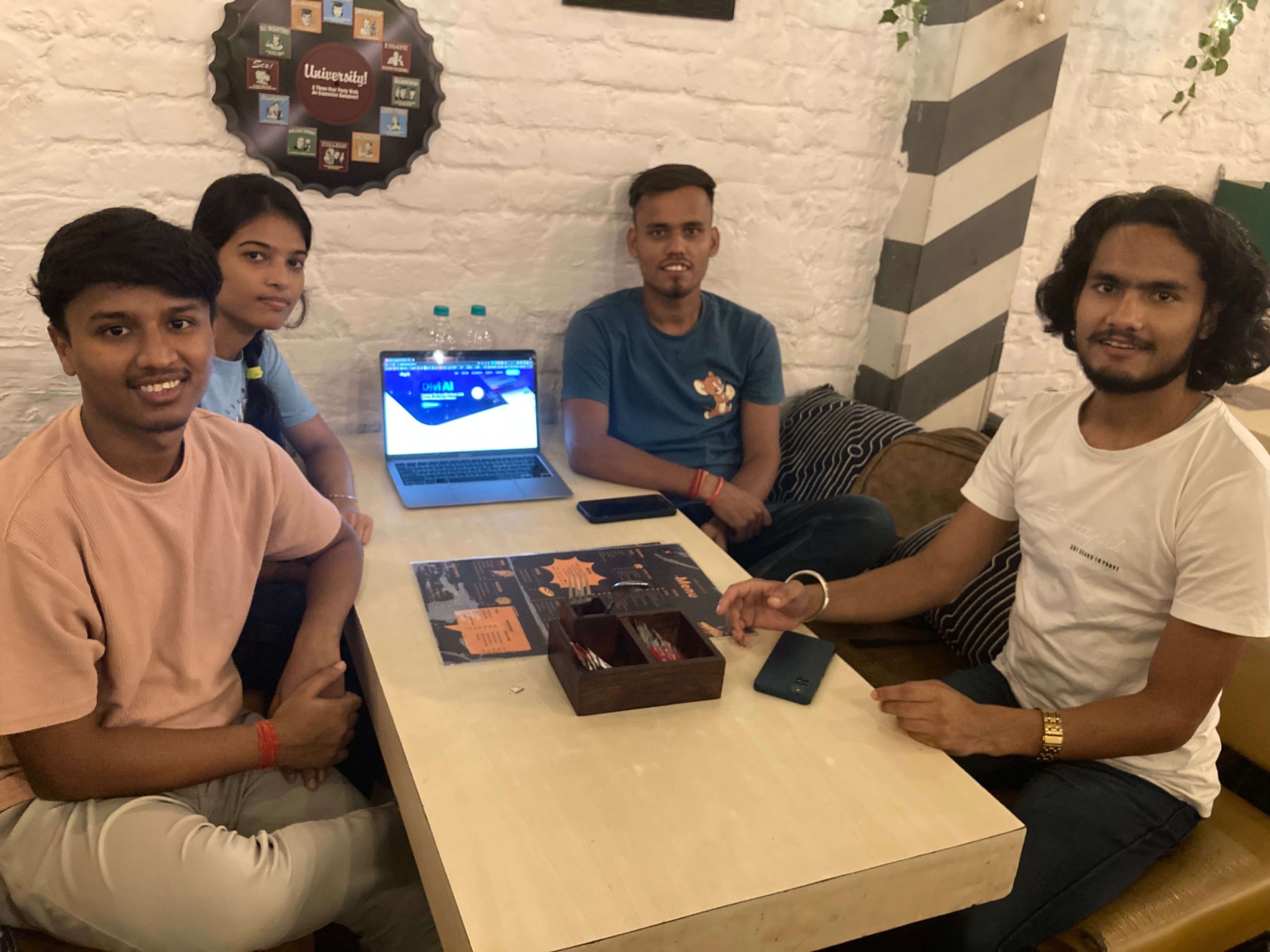 4 people sitting around a desk at the Divi Delhi NCR meetup 