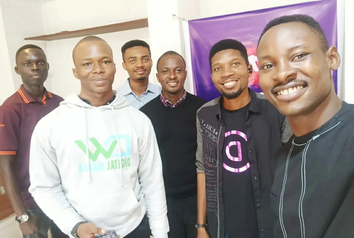 6 men standing next to each other at the Divi Uyo meetup